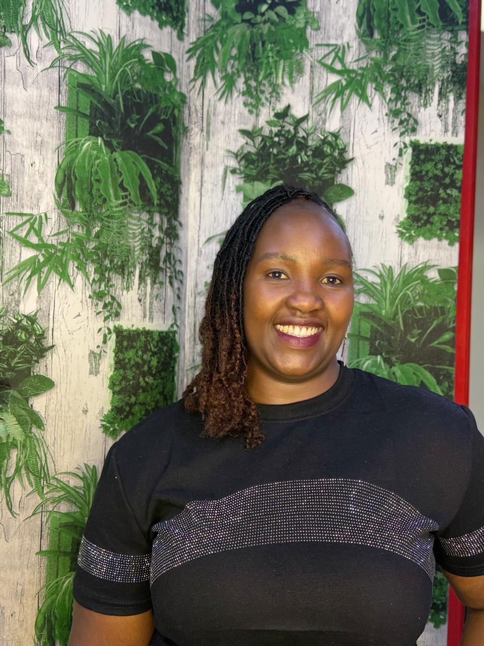 Client wearing custom human hair Sisterlocks extensions at Locstime254 salon