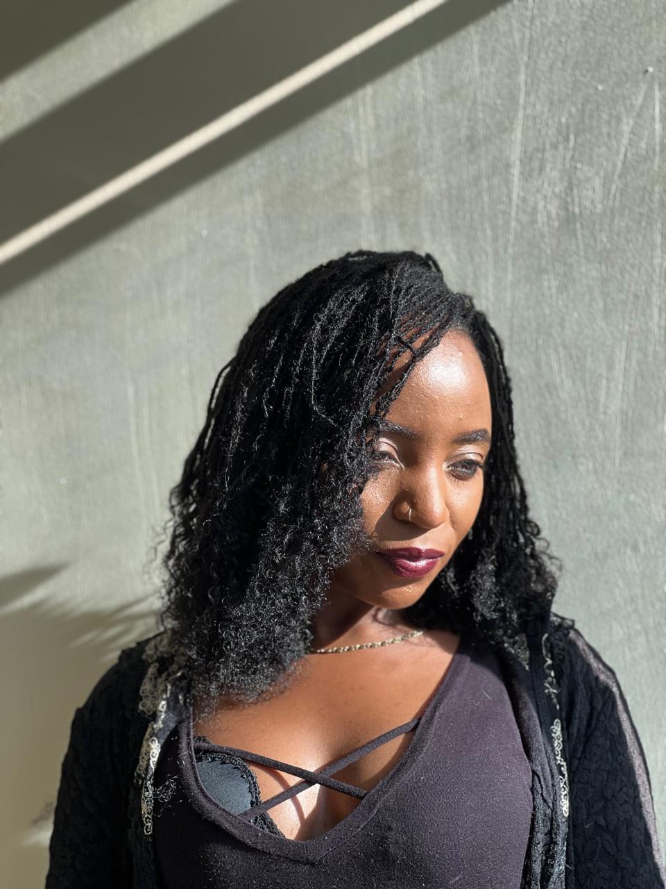 Natural black human hair micro loc extensions styled in Nairobi