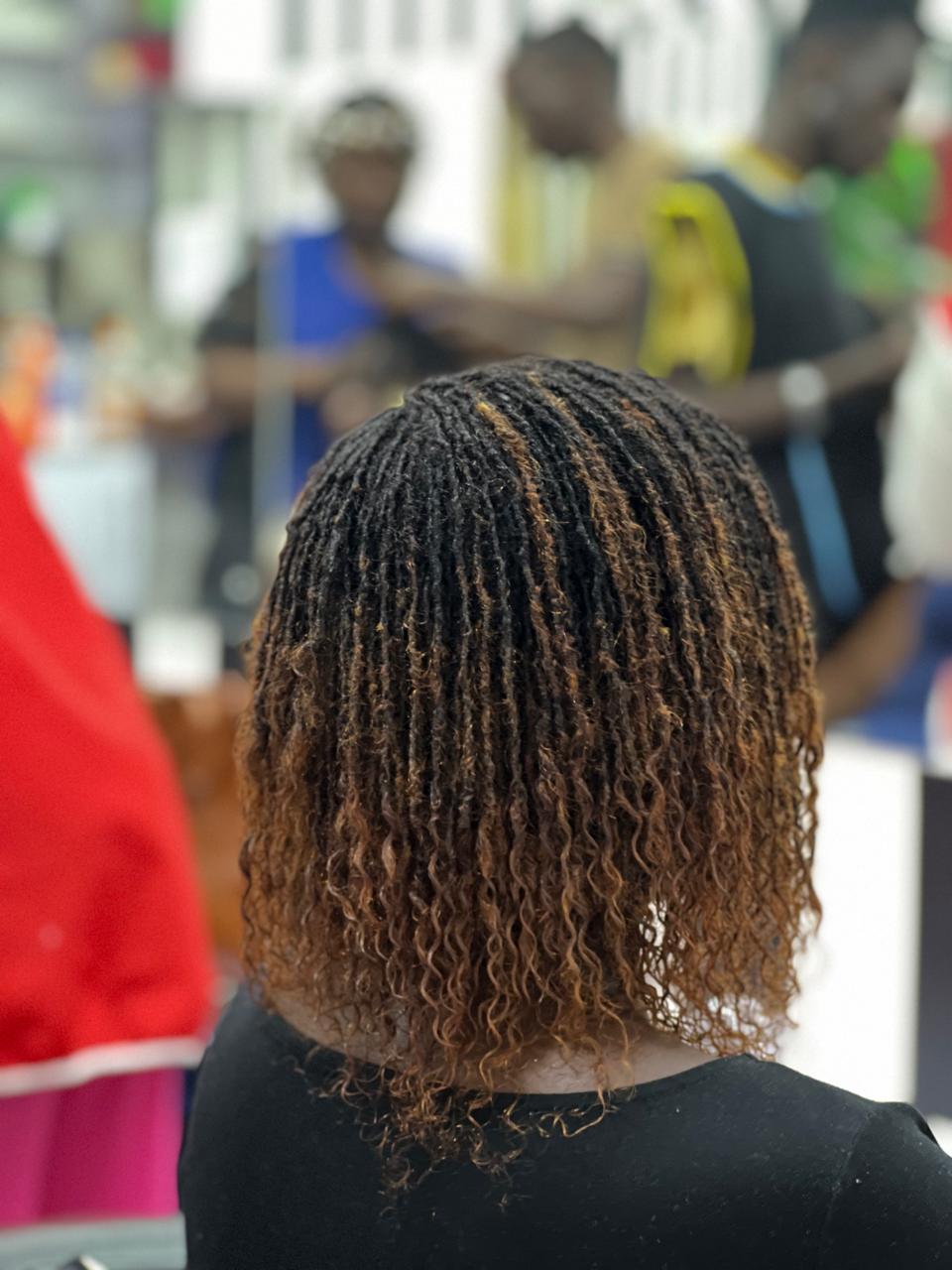 Coloured human hair Sisterlocks extensions in warm auburn tones