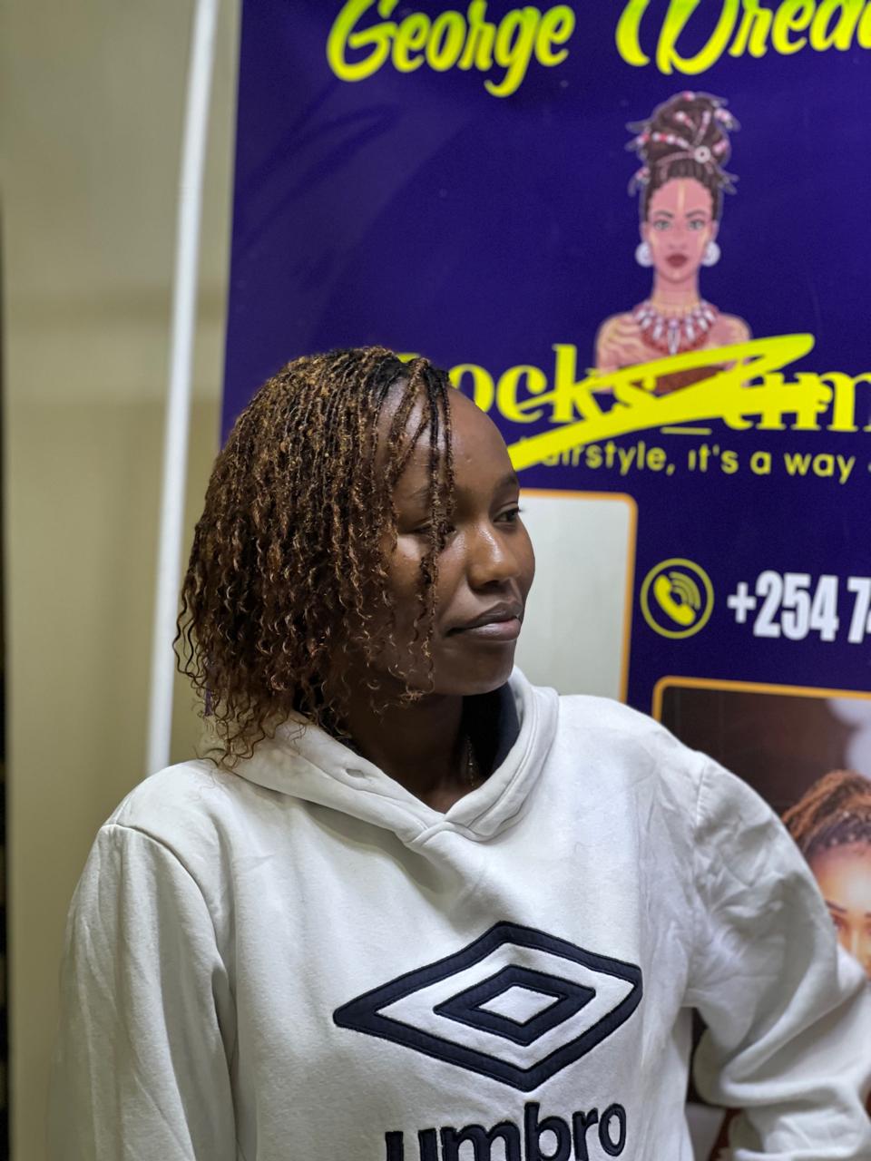 Warm caramel human hair Sisterlocks extensions styled at Locstime254